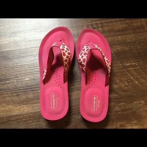 Pink coach flip flops